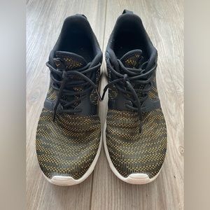 Gold and black Womens Nike Shoe